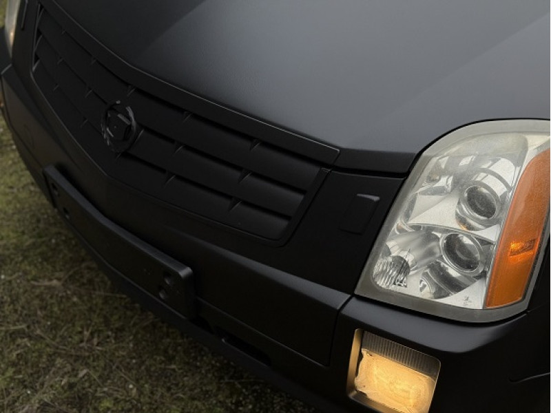 Cadillac SRX: повне фарбування в чорний RAPTOR
